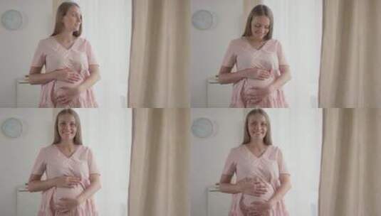 在婴儿房间里摸肚子的孕妇高清在线视频素材下载