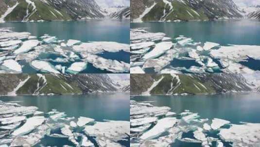 航拍山脉脚下厚厚冰层和青山绿水高清在线视频素材下载