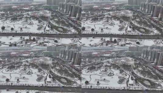大雪中的街道航拍-亳州涡阳-法治广场高清在线视频素材下载
