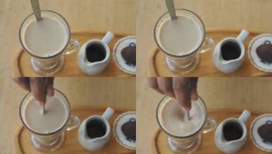 一杯咖啡拿铁在桌子上高清在线视频素材下载