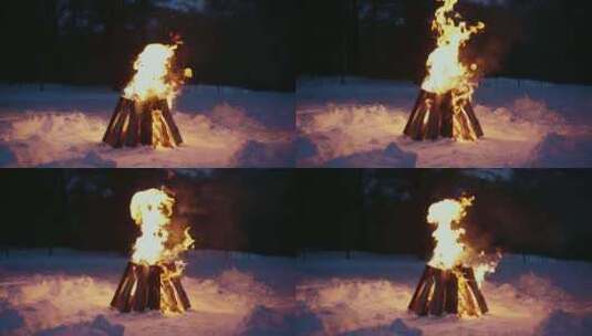 特写雪地里燃起熊熊大火的篝火高清在线视频素材下载