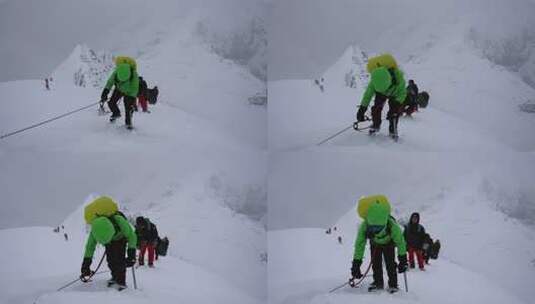 风雪中攀登四川贡嘎山区贡巴峰的登山者高清在线视频素材下载