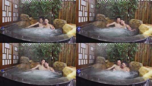 情侣在温泉中享受放松时光高清在线视频素材下载