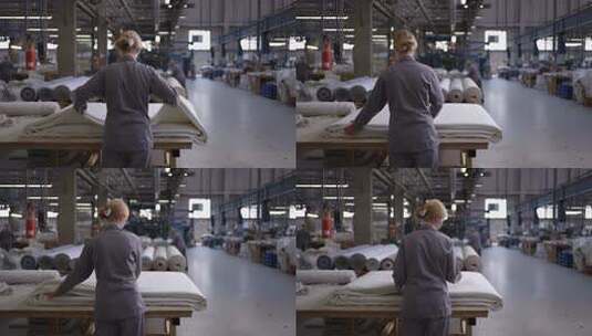 工厂女工整理纺织布料高清在线视频素材下载