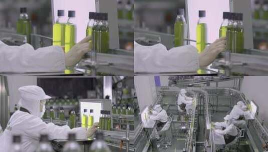 工厂工人操作流水线瓶装产品高清在线视频素材下载