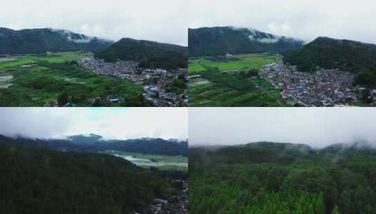 云雾缭绕的湿地公园山脉村庄航拍高清在线视频素材下载