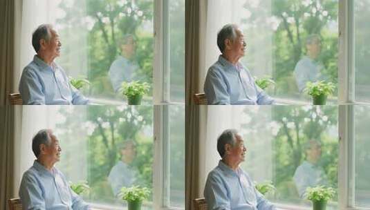 老人窗边静坐凝视窗外高清在线视频素材下载