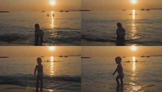 假期海滩上玩耍的小男孩剪影高清在线视频素材下载