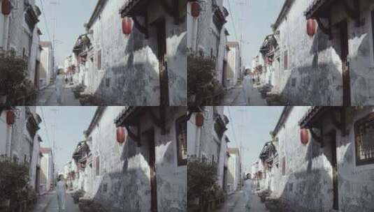 美女走在挂着灯笼的中国古街道高清在线视频素材下载