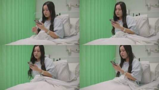 女人坐在病床上玩手机高清在线视频素材下载