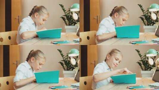 女孩坐在书桌旁读书高清在线视频素材下载