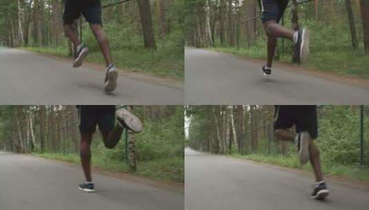 男人在林间公路上奔跑腿部特写高清在线视频素材下载
