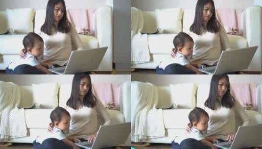 母亲和她的小男孩玩电脑的镜头高清在线视频素材下载