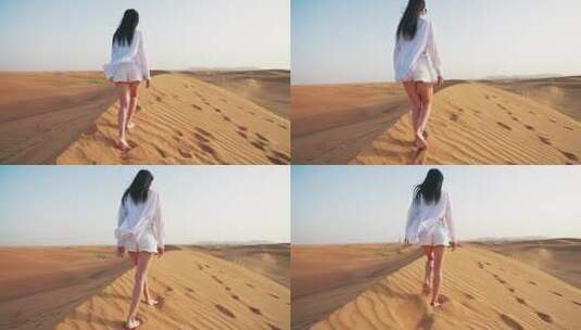 在沙丘上行走的女人高清在线视频素材下载