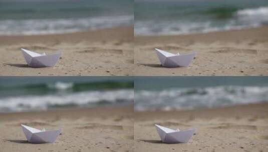 海滩上的白纸船高清在线视频素材下载