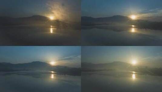 山峰湖泊日出雾气弥漫远山湖面太阳升起高清在线视频素材下载