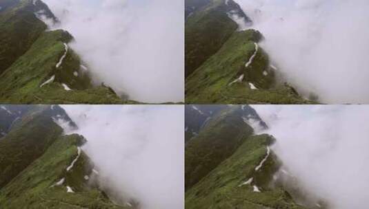航拍一半碧绿一半云雾缭绕的山脉高清在线视频素材下载