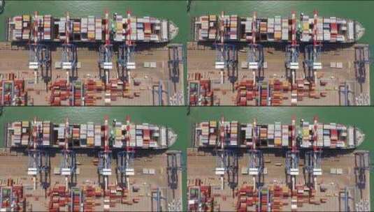 商港码头，起重机正在卸载集装箱船高清在线视频素材下载