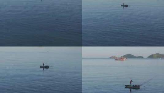 日出时宁静海面上渔船的鸟瞰图，印度尼西亚高清在线视频素材下载