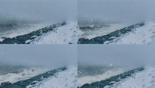 海边雪景与海浪拍打岩石高清在线视频素材下载