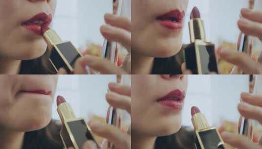 女人拿着化妆镜描口红的特写高清在线视频素材下载