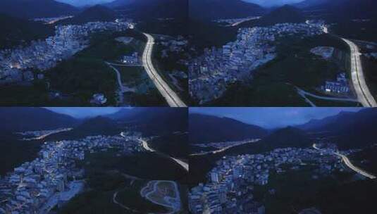 航拍广东茂名信宜钱排镇群山环绕的城镇夜景高清在线视频素材下载