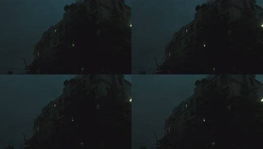 雨夜窗外的城市居民楼灯光和闪电高清在线视频素材下载