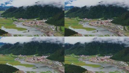 西藏林芝鲁朗小镇云海村庄建筑田园风光航拍高清在线视频素材下载