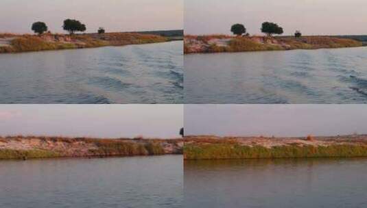 卡普里维地带/赞比西河区域夏季沿赞比西河纳米比亚一侧的游船高清在线视频素材下载