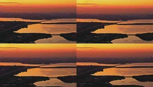 航拍苏州阳澄湖城市自然风光落日黄昏夕阳高清在线视频素材下载