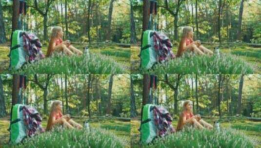 坐在草地上喝茶的女孩高清在线视频素材下载