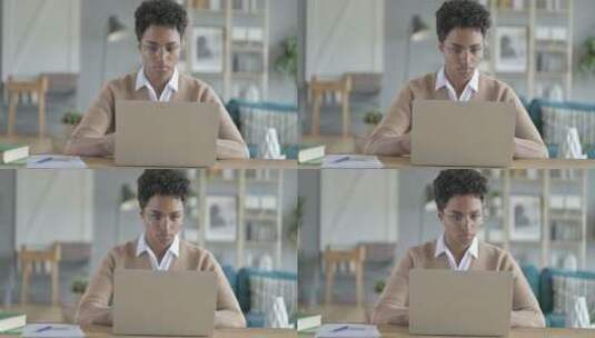 非洲女孩使用笔记本电脑工作高清在线视频素材下载
