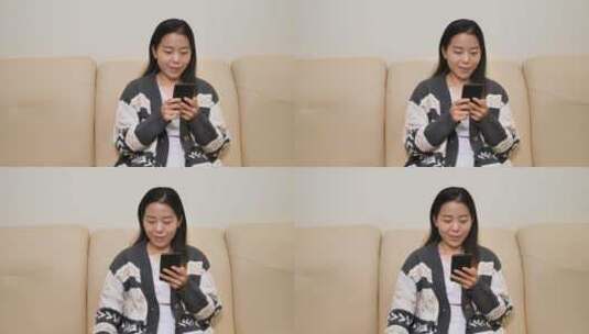 亚洲中国女性居家坐沙发办公玩手机上网购物高清在线视频素材下载