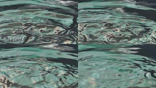 水滴落在水面上时的纹理高清在线视频素材下载