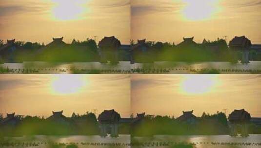 湖面水上建筑夕阳彩霞高清在线视频素材下载