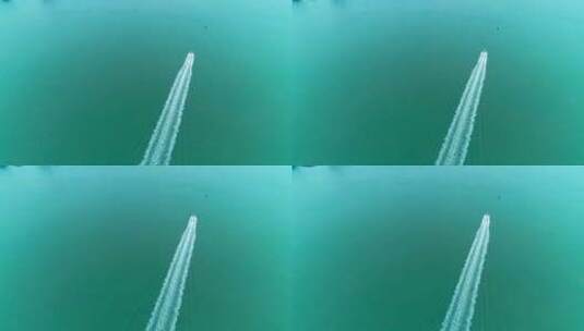 航拍深圳港附近海面一艘快艇飞速行驶高清在线视频素材下载