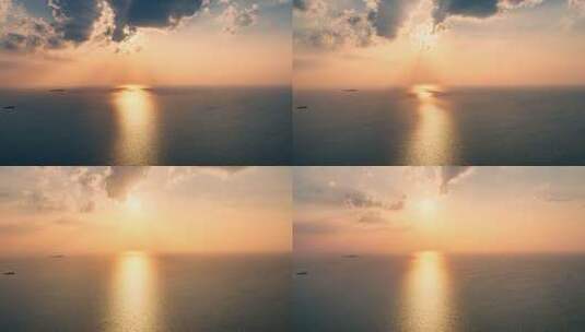 航拍海上夕阳海绵波光粼粼金黄色的海面高清在线视频素材下载