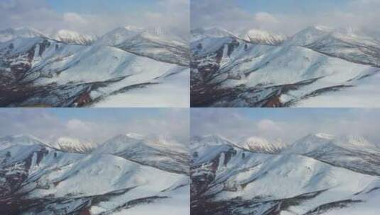航拍风雪中的洛隆县雪山风光高清在线视频素材下载