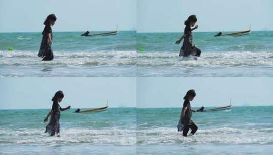 海边踏浪的小女孩高清在线视频素材下载