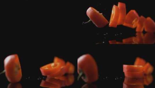 黄辣椒的切片落在板上的慢镜头特写高清在线视频素材下载