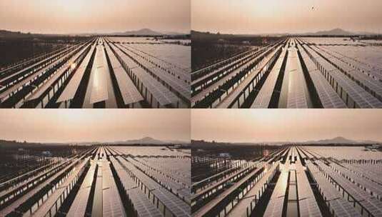 夕阳下太阳能光伏发电站航拍高清在线视频素材下载