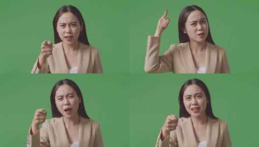 愤怒的亚洲女商人站在工作室的绿屏上责骂的特写镜头高清在线视频素材下载
