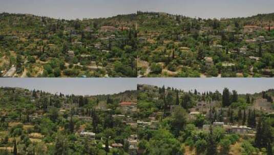 山上的村庄，覆盖着森林，红色屋顶，白色建筑，阿拉伯村庄，苍蝇前言，一个高清在线视频素材下载