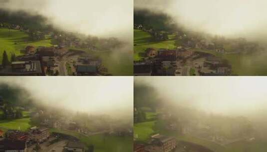 迷雾笼罩的阿尔卑斯山老式建筑小镇高清在线视频素材下载