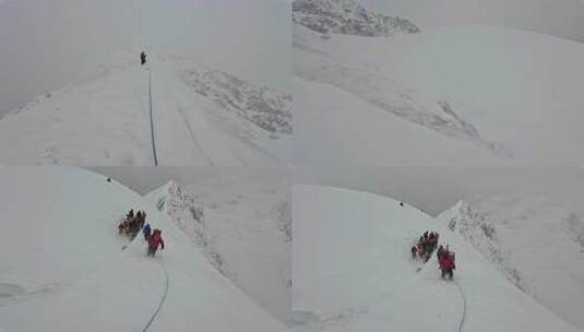 风雪中攀登四川贡嘎山区贡巴峰的登山者高清在线视频素材下载