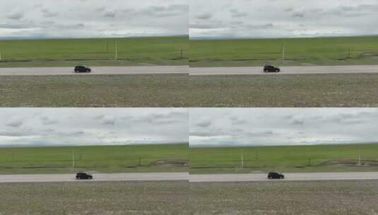 草原公路航拍跟拍汽车高清在线视频素材下载