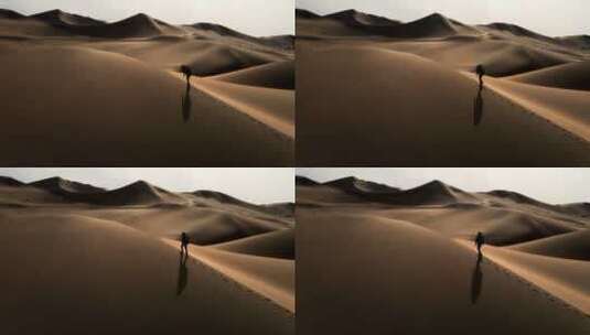 沙漠人行走航拍高清在线视频素材下载