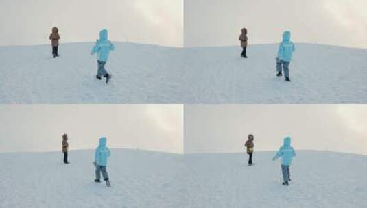 孩子在雪地打雪球高清在线视频素材下载