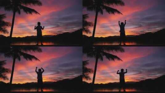 夕阳下举起双手庆祖胜利的儿童高清在线视频素材下载