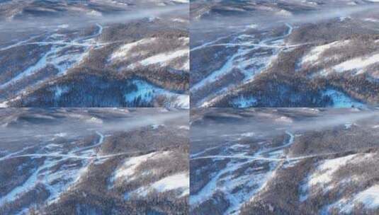 航拍冷空气缭绕的冬季山林冰河高清在线视频素材下载
